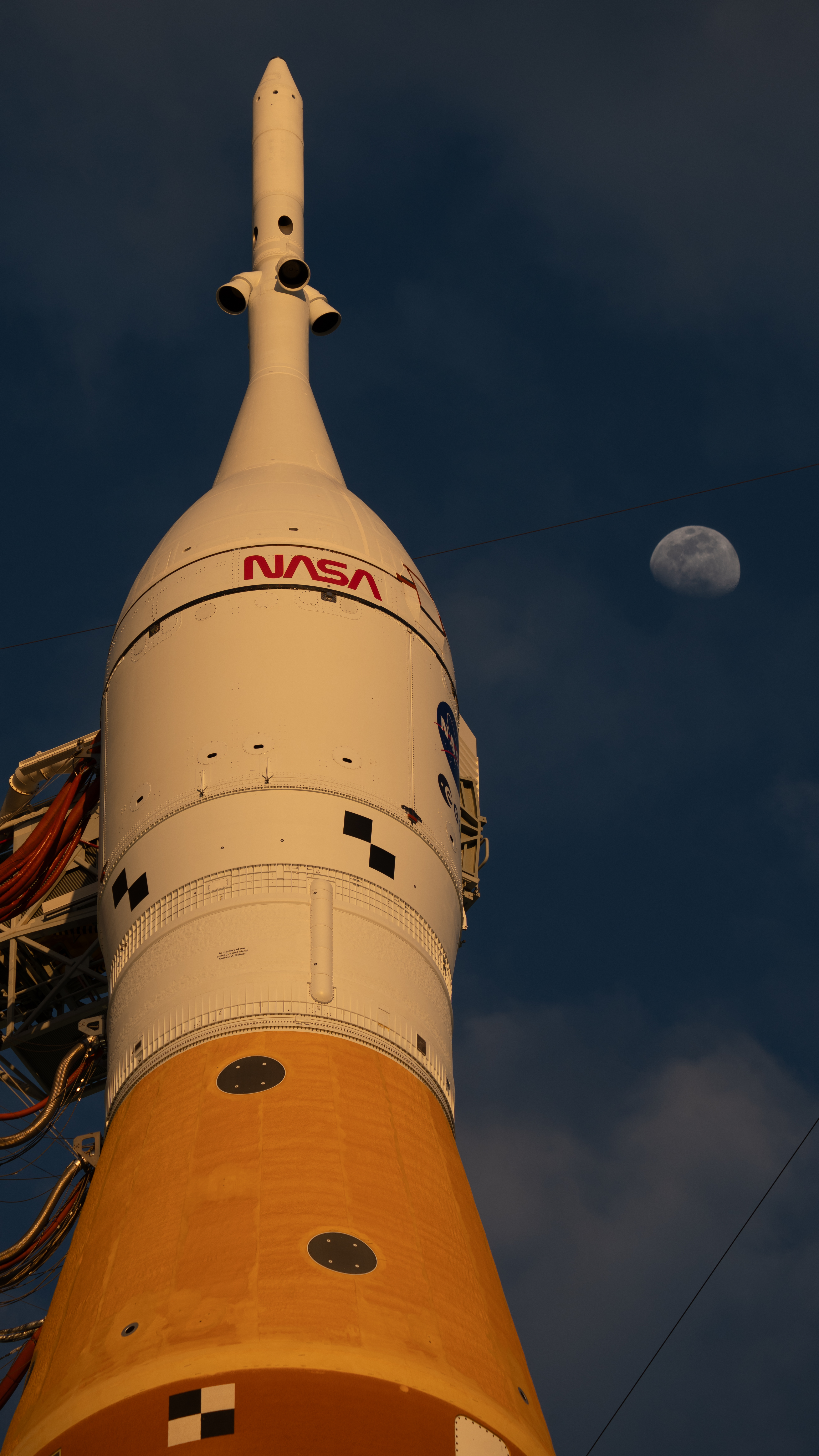 Moon Seen Shining on Full Artemis II Stack at Launch Pad 39B